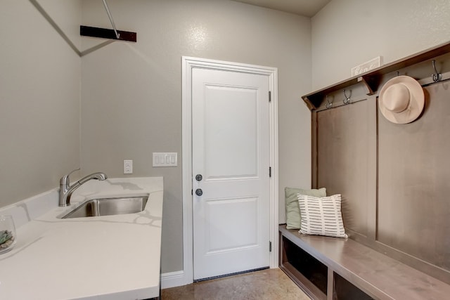 mudroom with sink and tile flooring