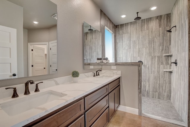 bathroom with double vanity and tile flooring