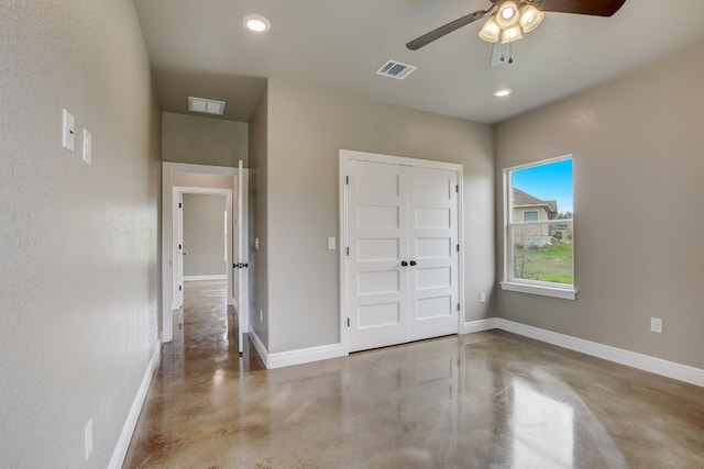 unfurnished bedroom featuring a closet and ceiling fan