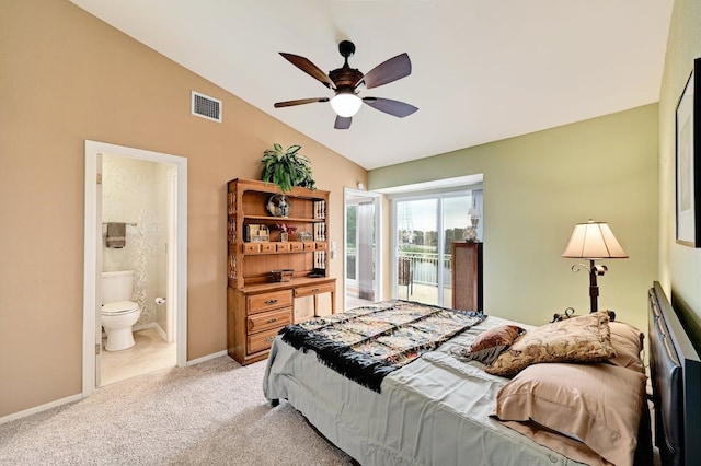 bedroom featuring ensuite bathroom, lofted ceiling, ceiling fan, light tile floors, and access to exterior