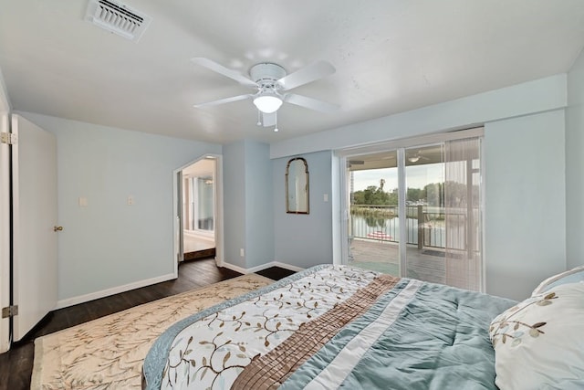 bedroom with ceiling fan, access to exterior, and dark wood-type flooring