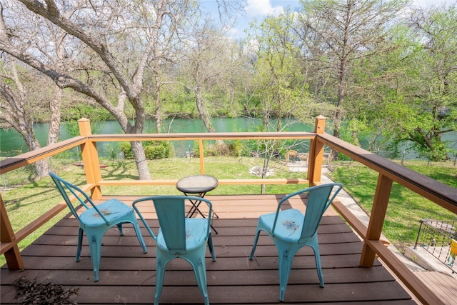 wooden deck with a water view