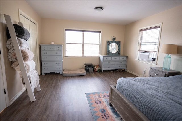 bedroom featuring a closet and dark hardwood / wood-style flooring