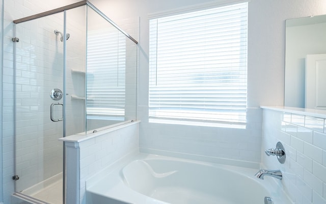 bathroom featuring a washtub