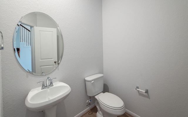 bathroom with sink and toilet