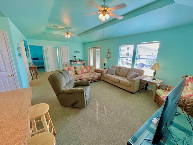 living room with light carpet, french doors, ceiling fan, and a tray ceiling