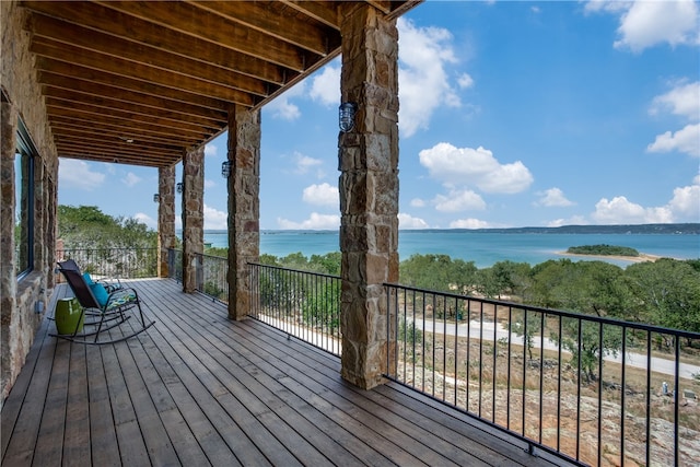 deck featuring a water view