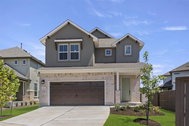 view of front of home featuring a garage and a front lawn