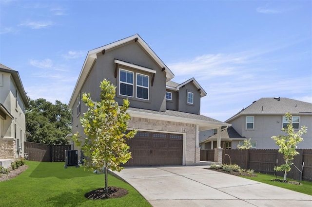 view of front of house with cooling unit, a front yard, and a garage