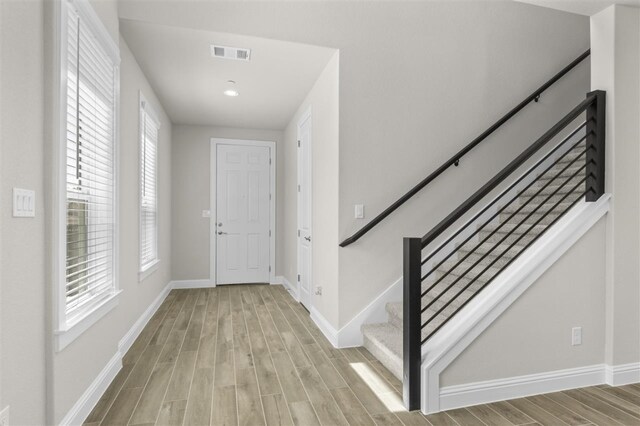 foyer featuring light hardwood / wood-style floors and plenty of natural light