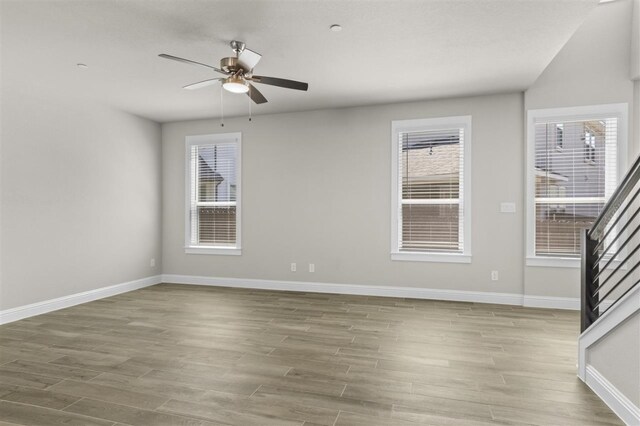 spare room with light hardwood / wood-style floors and ceiling fan