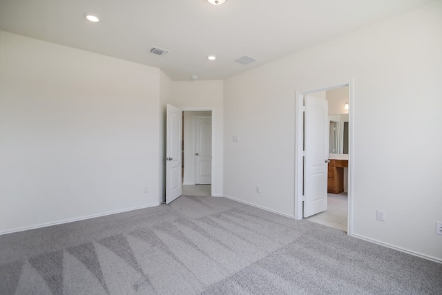 spare room with light colored carpet