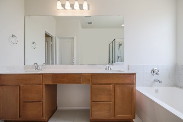 bathroom featuring vanity, independent shower and bath, and tile patterned flooring