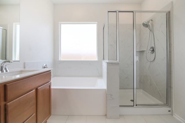 bathroom featuring vanity, separate shower and tub, and tile patterned floors