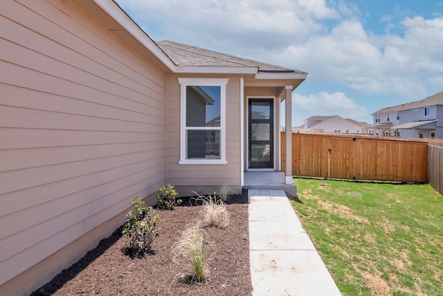 entrance to property with a yard