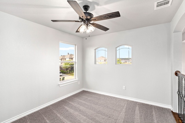 carpeted empty room with ceiling fan