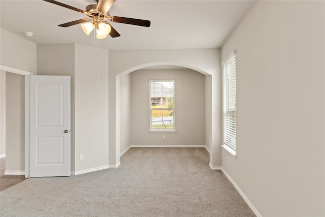 carpeted empty room with ceiling fan