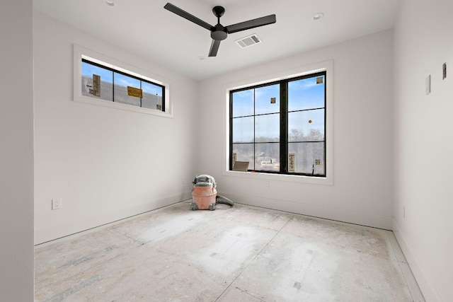 unfurnished room featuring visible vents, ceiling fan, and baseboards