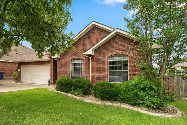 front facade featuring a front lawn and a garage