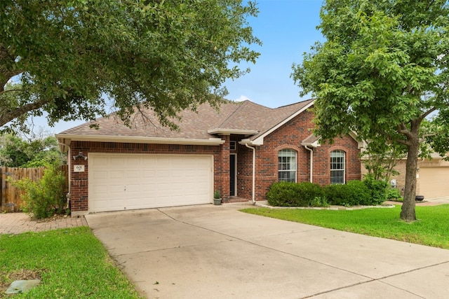 ranch-style house featuring a garage