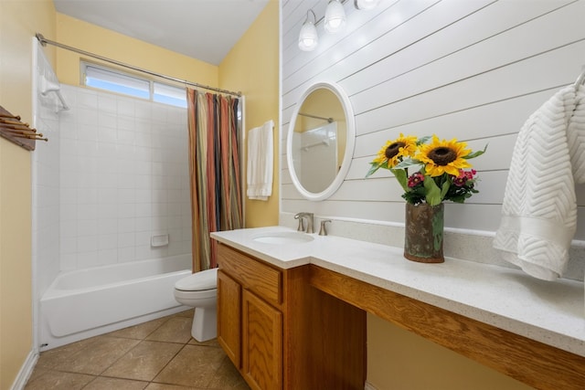 full bathroom with shower / bath combination with curtain, tile flooring, toilet, and vanity with extensive cabinet space