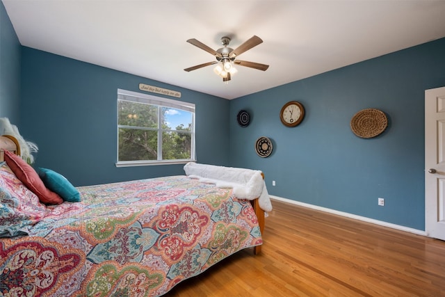 bedroom featuring light hardwood / wood-style flooring and ceiling fan