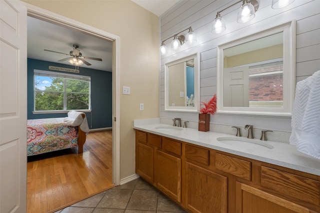 bathroom featuring dual vanity, tile flooring, and ceiling fan