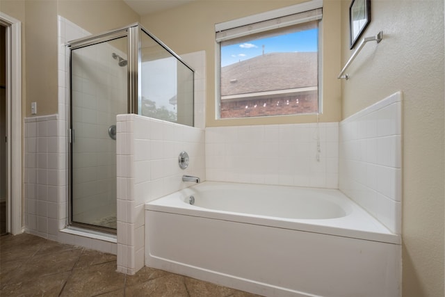 bathroom with independent shower and bath and tile floors