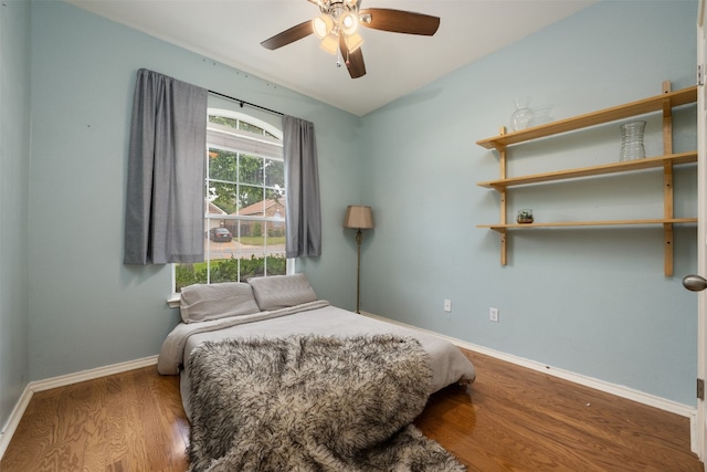 bedroom featuring ceiling fan and hardwood / wood-style flooring