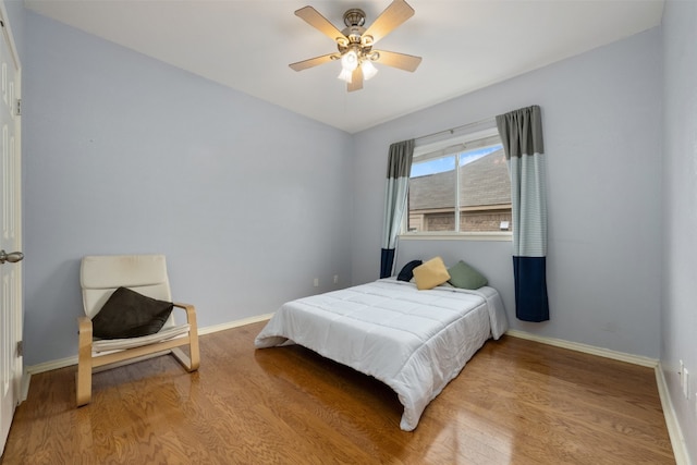 bedroom featuring ceiling fan and light hardwood / wood-style floors