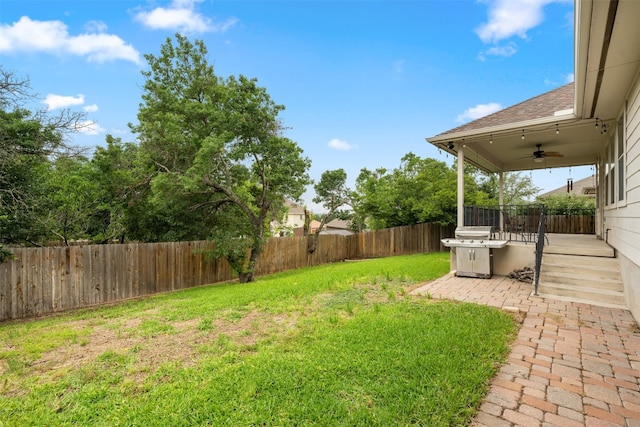 view of yard with ceiling fan