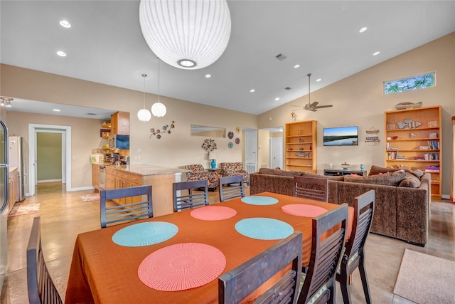 dining room with ceiling fan and lofted ceiling