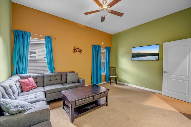 carpeted living room featuring ceiling fan