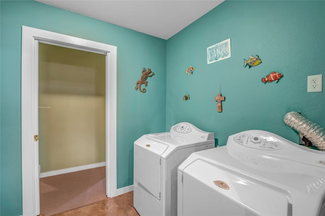 laundry area with light carpet and washer and clothes dryer