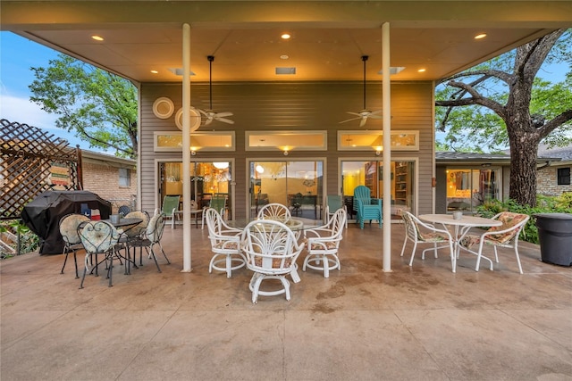 view of terrace featuring a grill and ceiling fan