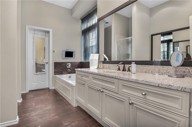 bathroom featuring oversized vanity and plus walk in shower