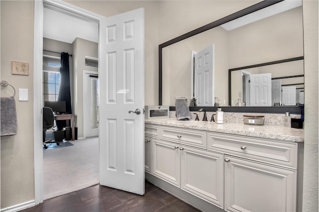 bathroom with vanity and tile flooring