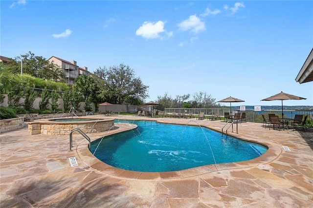 view of pool featuring a community hot tub and a patio