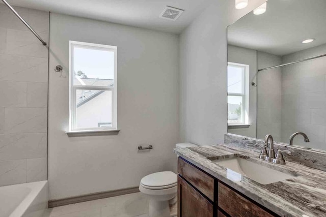 full bathroom featuring toilet, vanity, tiled shower / bath, and tile flooring