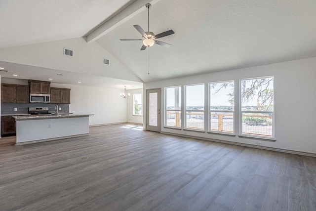 unfurnished living room featuring high vaulted ceiling, beamed ceiling, ceiling fan with notable chandelier, dark hardwood / wood-style floors, and sink