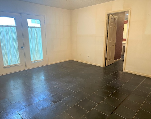 tiled empty room with french doors