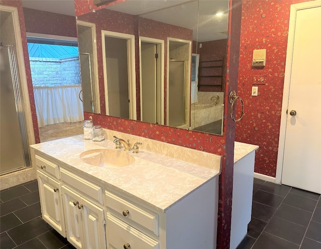 bathroom featuring a shower with door, large vanity, and tile floors