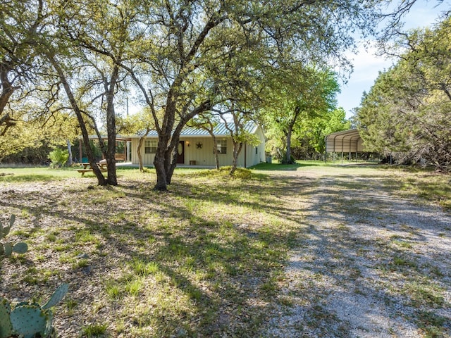 view of yard featuring a carport