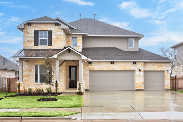 view of front facade with a front yard and a garage