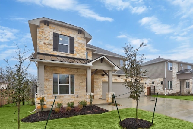 craftsman-style house with a front yard and a garage