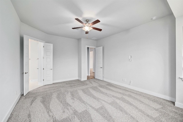 unfurnished bedroom with ceiling fan and light carpet