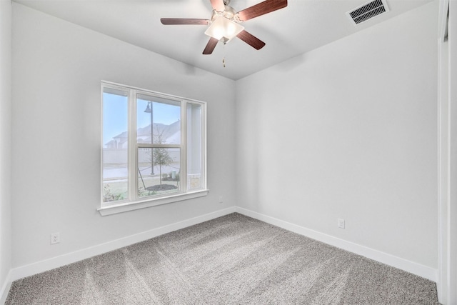 unfurnished room with ceiling fan and light carpet