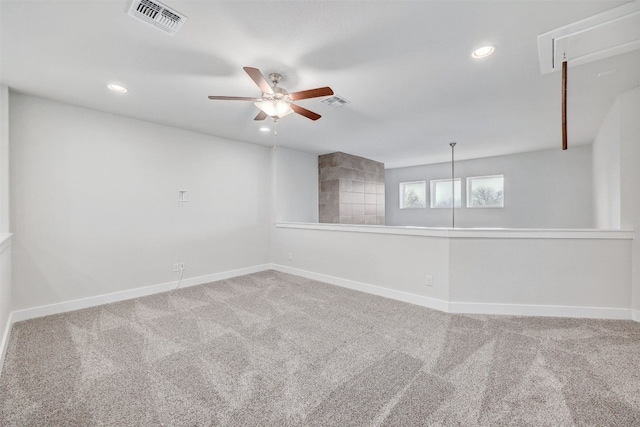 empty room with ceiling fan and carpet