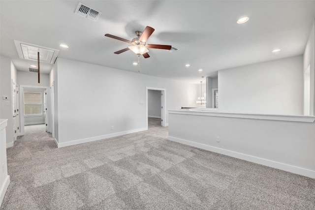 empty room featuring ceiling fan and light colored carpet