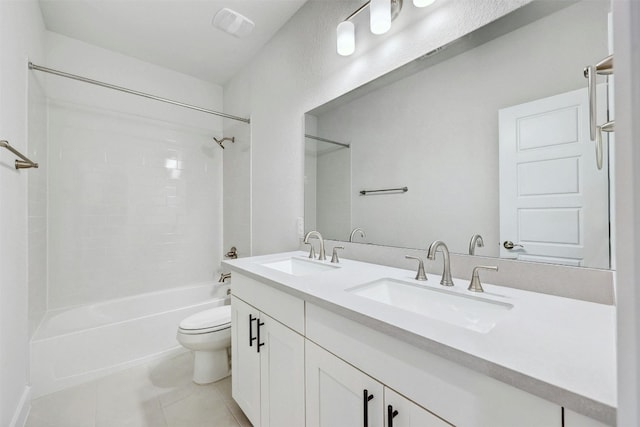 full bathroom featuring dual sinks, shower / bathing tub combination, tile flooring, toilet, and large vanity